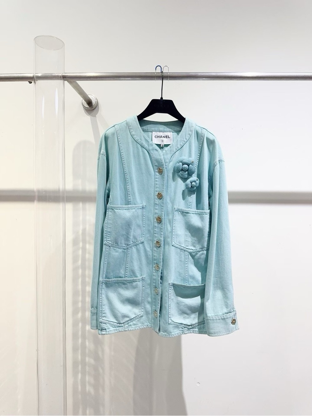 CHANEL Light Blue Denim Jacket with Silver Star Button
